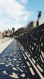 Walkway against sky