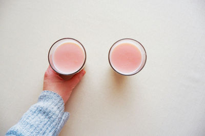 High angle view of hand holding drink