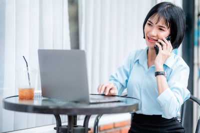 Businesswoman working at table