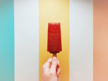 Close-up of hand holding ice cream