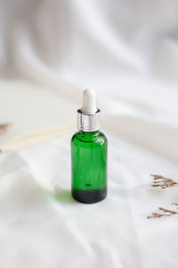 High angle view of glass bottle on table