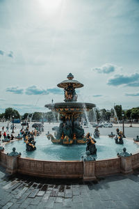 Statue of people at fountain