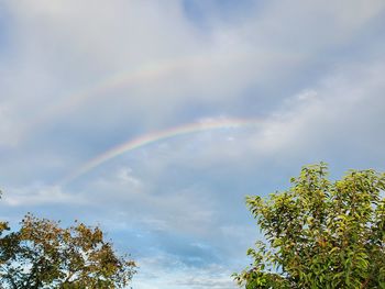 Low angle view of rainbow against sky