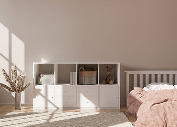 Empty cream wall in modern child room. mock up interior in scandinavian style. 