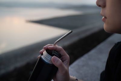 Close-up of woman hand holding cigarette