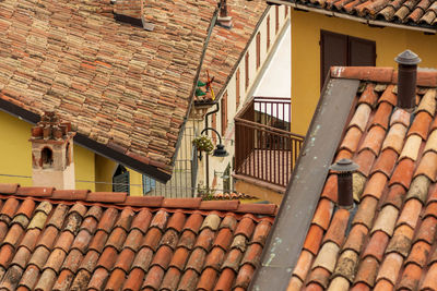 Old terracotta shingles on the old houses roofs in serralunga d'alba, piemonte, langhe wine district