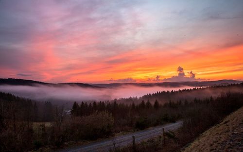 Scenic view of landscape against sky during sunset