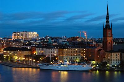 Illuminated city at waterfront