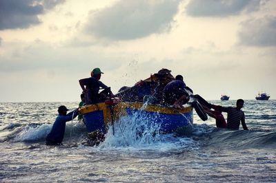 People enjoying in sea