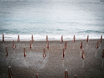 Wooden posts on beach