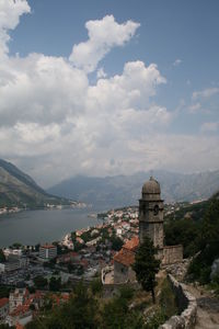 High angle view of town against cloudy sky