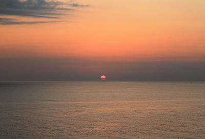 Scenic view of sea at sunset