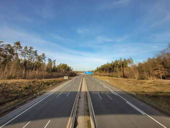 Empty road against sky