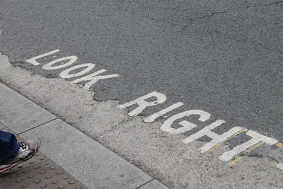 High angle view of road sign on street