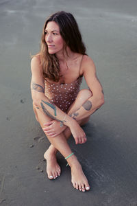 Beautiful woman on the beach in tofino
