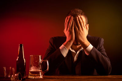 Portrait of a man sitting on table