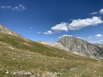 Scenic view of landscape against blue sky