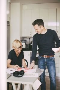 Man and woman having fun working from home