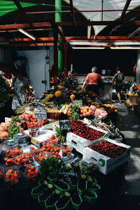 People at market stall