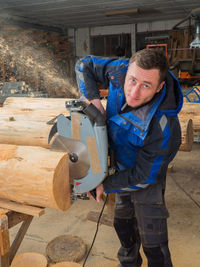 Man working on wood in workshop