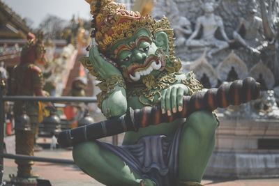 Close-up of statue against temple