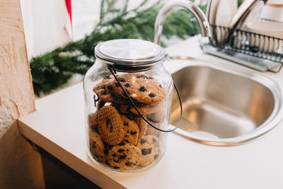 Close-up of cookies in glass jar on table