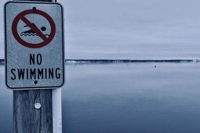 No swimming in the eerily still waters of muskegon lake