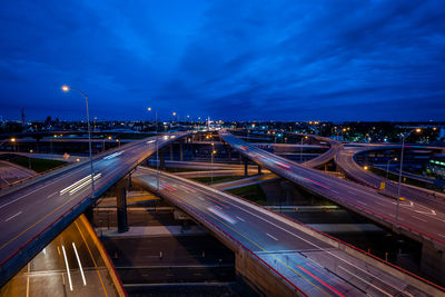 High angle view of illuminated bridge against sky at night