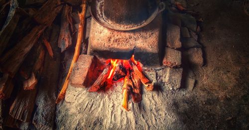High angle view of fire on wood