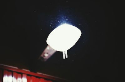 Low angle view of illuminated lamp