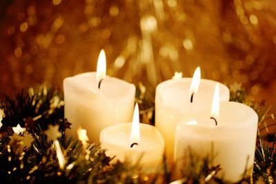 Close-up of illuminated christmas candles