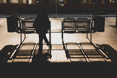 Man sitting on bench in bus