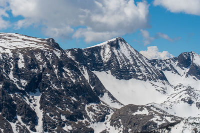 Landscape of snow-dappled mountain peaks in rocky mountain national park