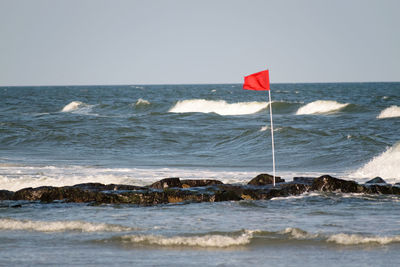 Scenic view of beach against clear sky