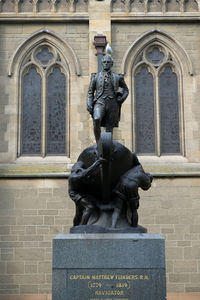 Statue in front of building