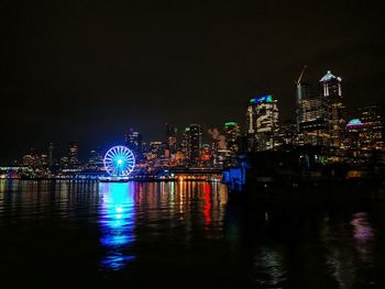 Illuminated buildings in city at night