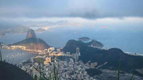 Sugarloaf mountain and cityscape against sky