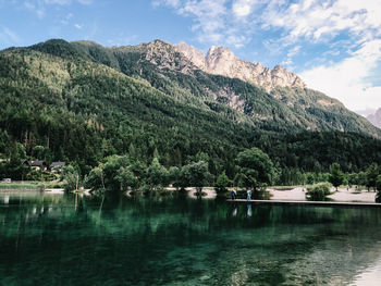 Scenic view of lake and mountains against sky