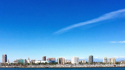 City skyline against blue sky