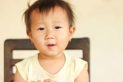 Portrait of cute baby at home
