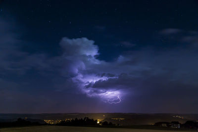 Scenic view of lightning in sky at night