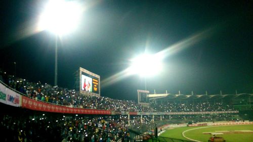 Panoramic view of people at night