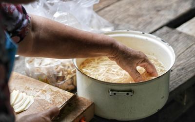 Midsection of man preparing food