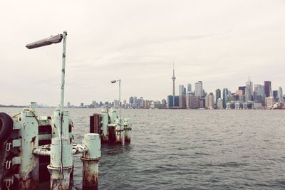 Panoramic view of sea and buildings against sky