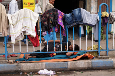 Group of people sitting at market