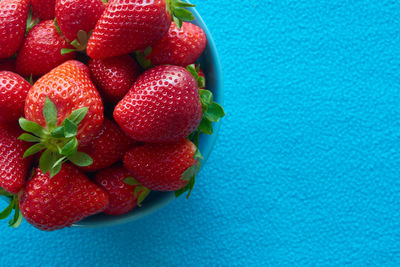 High angle view of strawberries on table