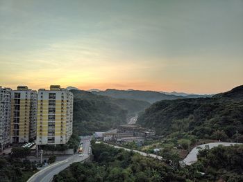 High angle view of buildings against sky during sunset