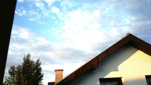 High section of building against cloudy sky