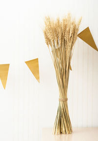 Autumn harvest party celebrating. barley spiklets and bunting. vertical size. harvesting  concept.