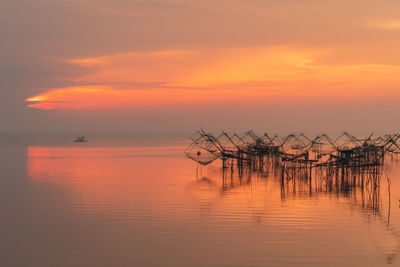 Scenic view of sea against orange sky